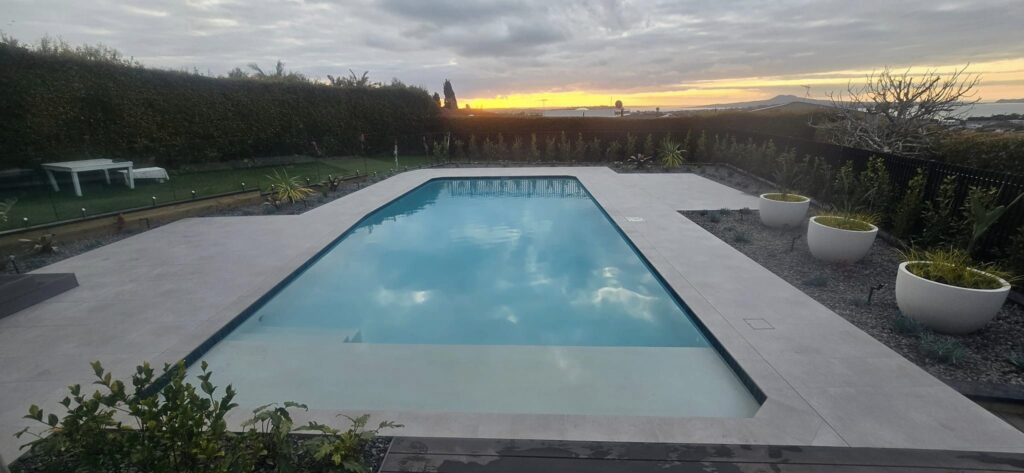 Infinity edge detail on concrete pool build Auckland