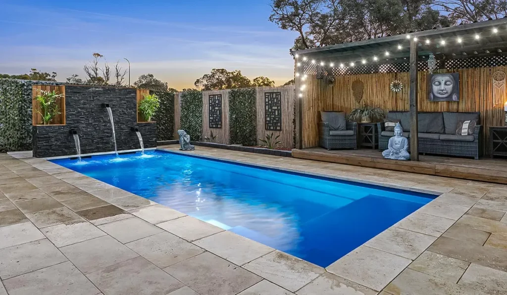 Stone pool coping and surround paving on a fibreglass pool in Auckland
