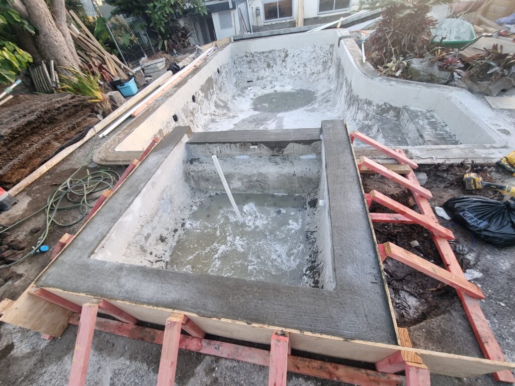 Concrete bond beam prepared before new pool coping is installed