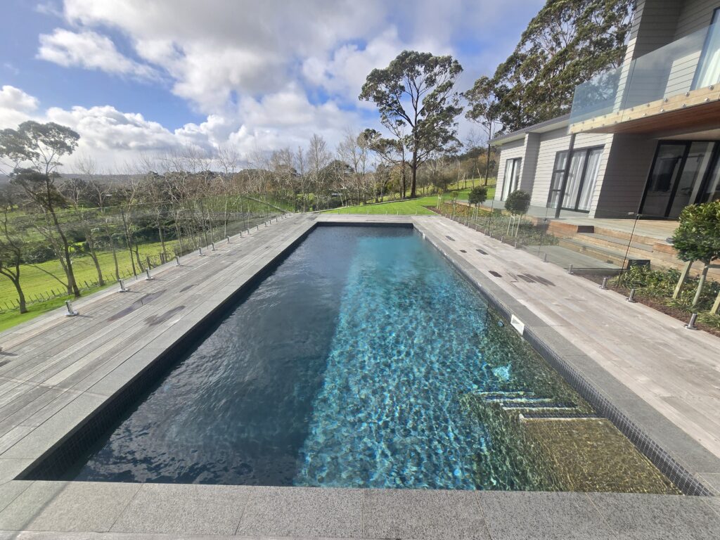 Custom concrete pool built on a steep Auckland section