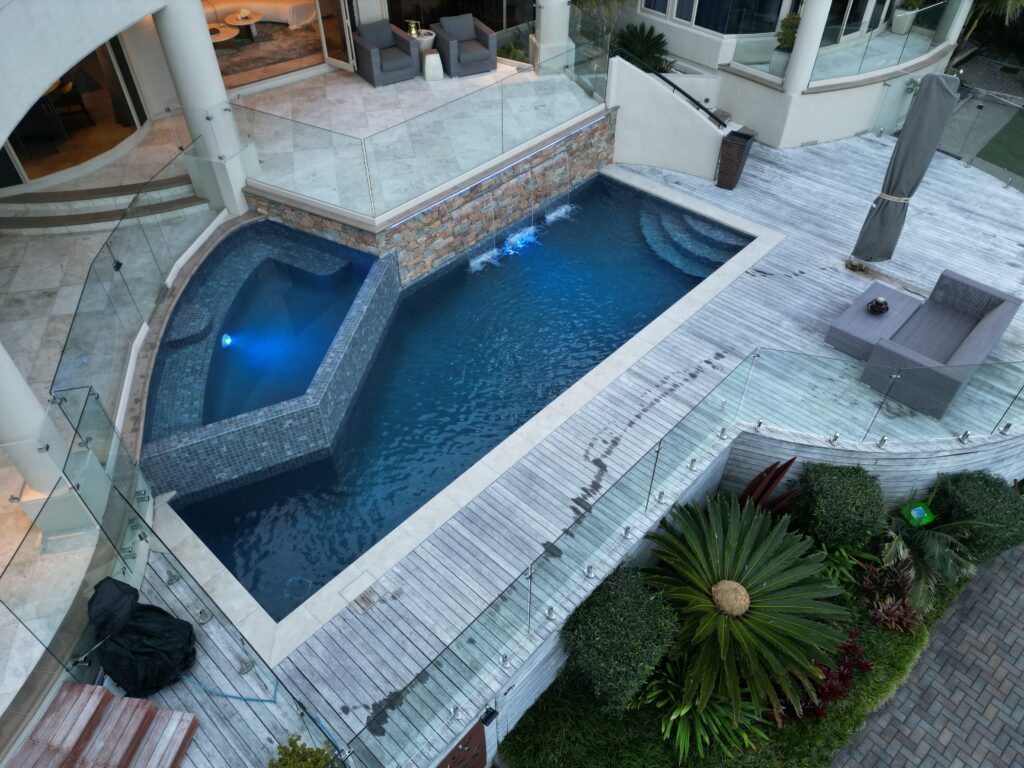 Auckland home with concrete pool and landscaped surrounds
