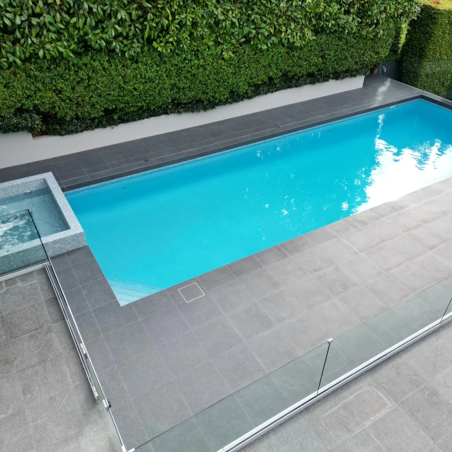 Porcelain tiled pool surround and coping in Remuera